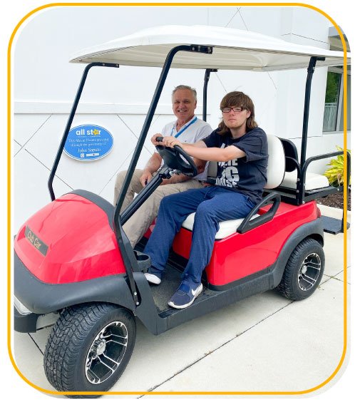 Shawn and Doug on a golf cart